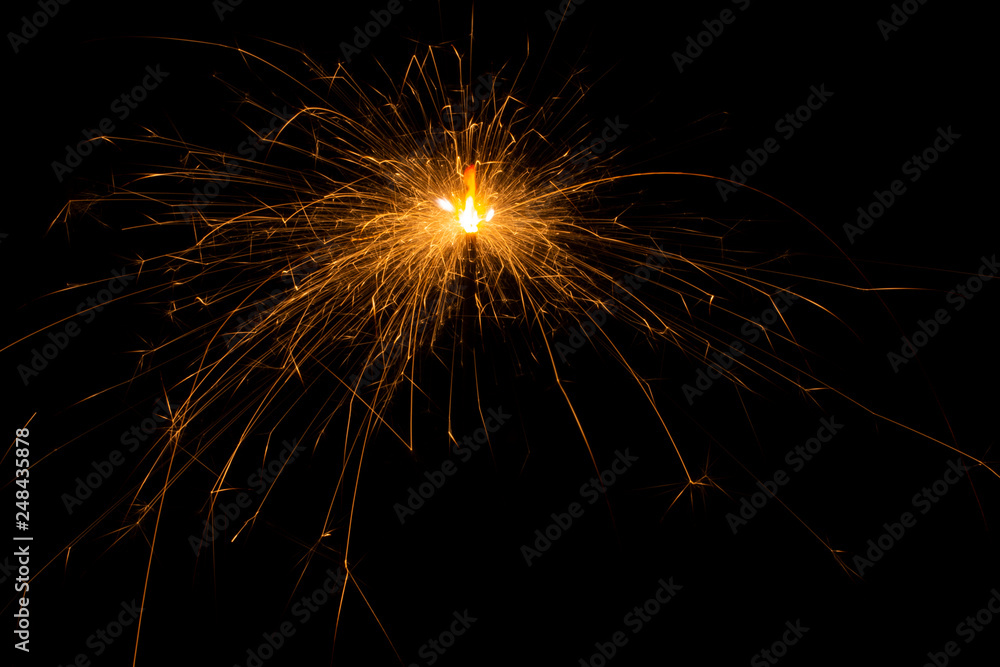 Bengal fire. New year sparkler candle on black background Bengal fire. New year sparkler candle on black background