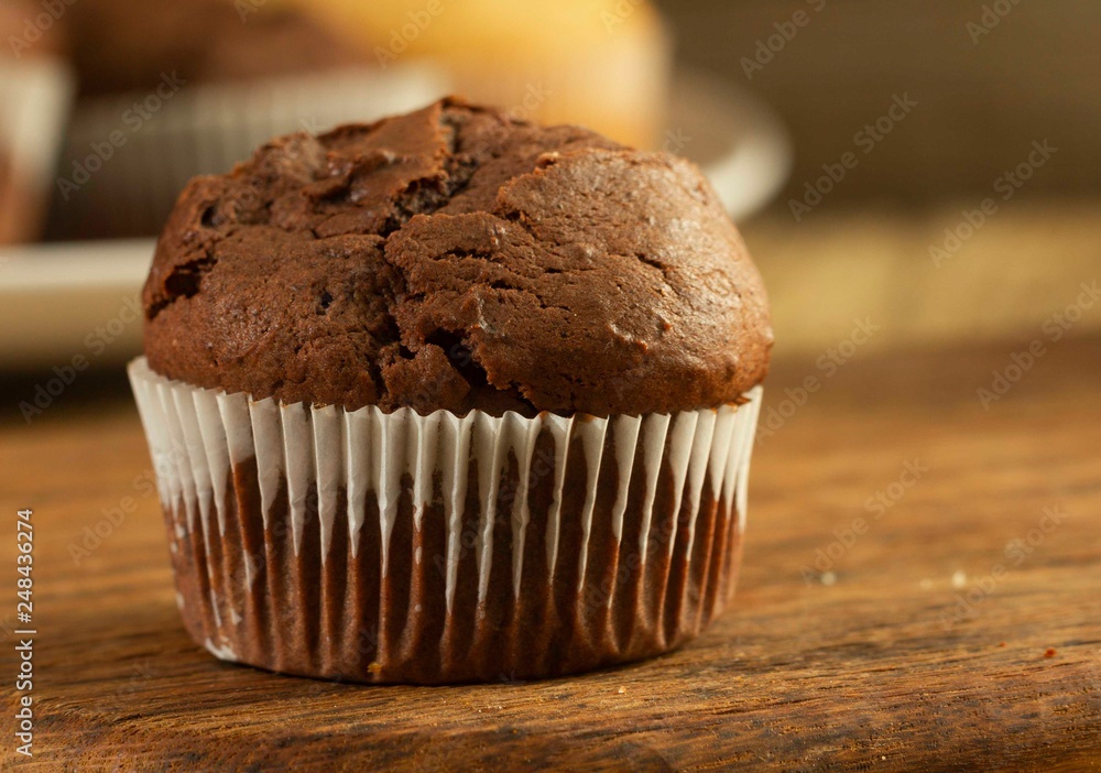 Chocolate cake and nut cake, homemade cakes on wooden background Chocolate cake and nut cake, homemade cakes on wooden background