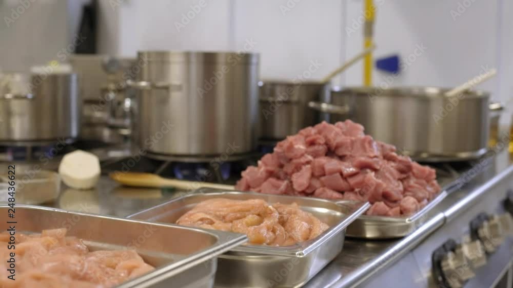pile of meat in professional dishes in kitchen pile of meat in professional dishes in kitchen