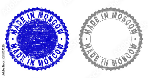 Grunge MADE IN MOSCOW stamp seals isolated on a white background. Rosette seals with distress texture in blue and grey colors.