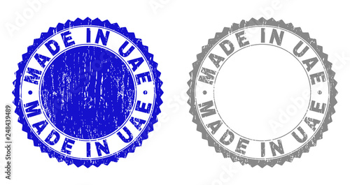 Grunge MADE IN UAE stamp seals isolated on a white background. Rosette seals with grunge texture in blue and grey colors. Vector rubber stamp imprint of MADE IN UAE caption inside round rosette.
