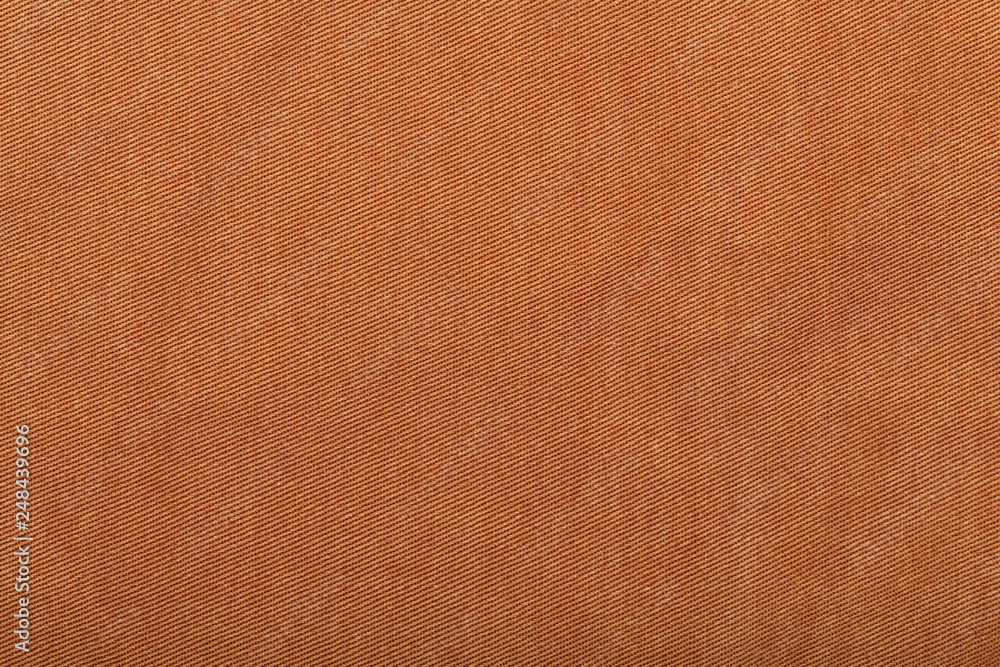 Fototapeta premium Denim jeans texture background with torn. The texture of the colored cotton fabric. Stitched texture jeans background. Fashion jeans button. Pocket and rivet on jeans. Fiber and fabric structure.