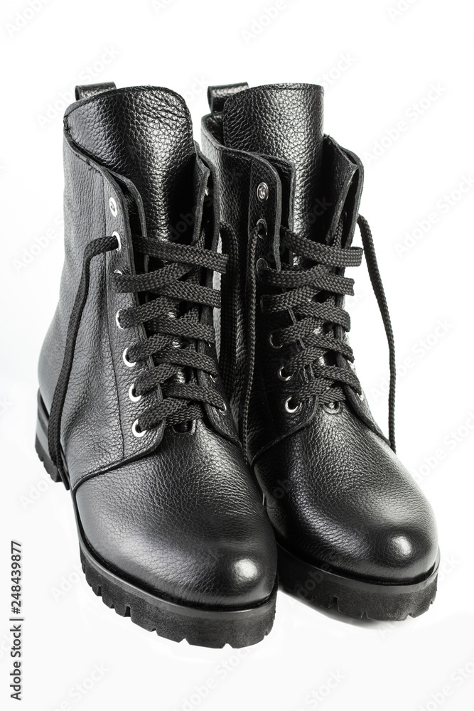 Ladies fashion leather shoes for autumn, spring, European winter. Boots for  a modern grunge woman. Women's black boots with laces isolated on white.  Black Leather Army Boots. Autumn. Fashion. Style. Photos
