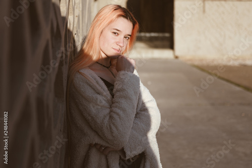 girl young hipster millennial with hair color against gray wall with space for text