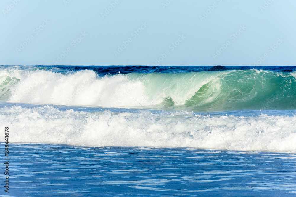 Ocean waves and blue sky background