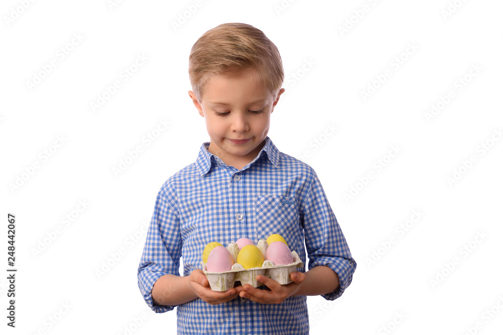 Easter and child. Boy and colorful Easter eggs in a small basket, yellow newborn chicken. White background. Easter and child. Boy and colorful Easter eggs in a small basket, yellow newborn chicken. White background.