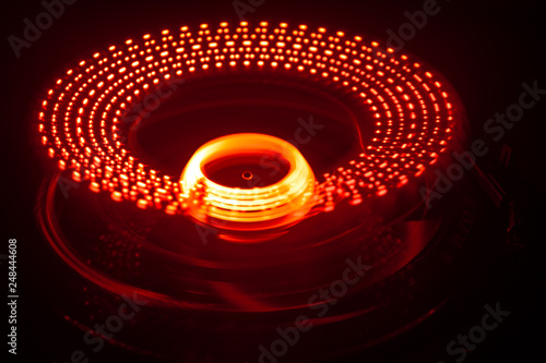 Concept of speed - Trail of fire and smoke - Vinyl record. Burning vinyl disk. Turntable vinyl record player. Retro audio equipment for disc jockey. Sound technology