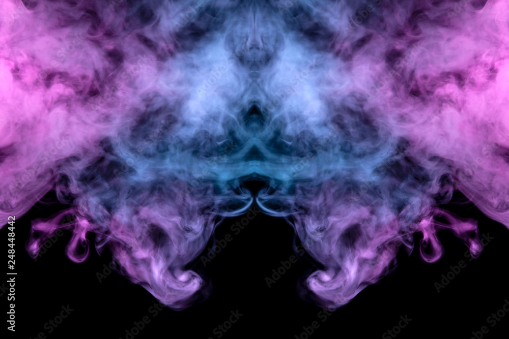A multi-colored pattern of purple and blue smoke of a mystical shape in the form of a ghost's head or a strange creature on a black isolated background. Abstract pattern in of waves and steam.
