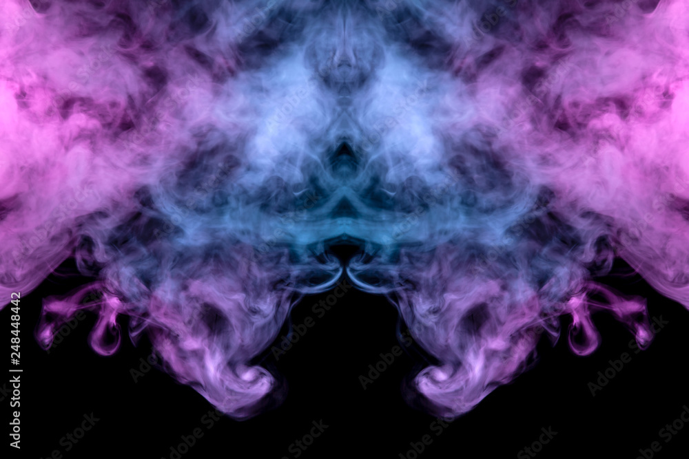 A multi-colored pattern of purple and blue smoke of a mystical shape in the form of a ghost's head or a strange creature on a black isolated background. Abstract pattern in of waves and steam. A multi-colored pattern of purple and blue smoke of a mystical shape in the form of a ghost's head or a strange creature on a black isolated background. Abstract pattern in of waves and steam.