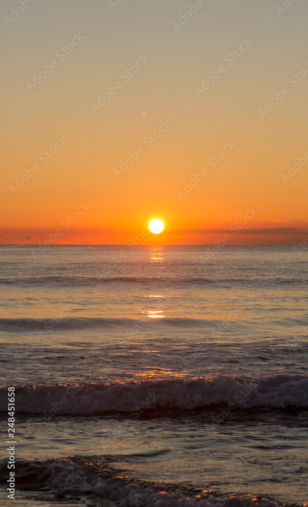 Sunrise on a beach of the mediterranean sea