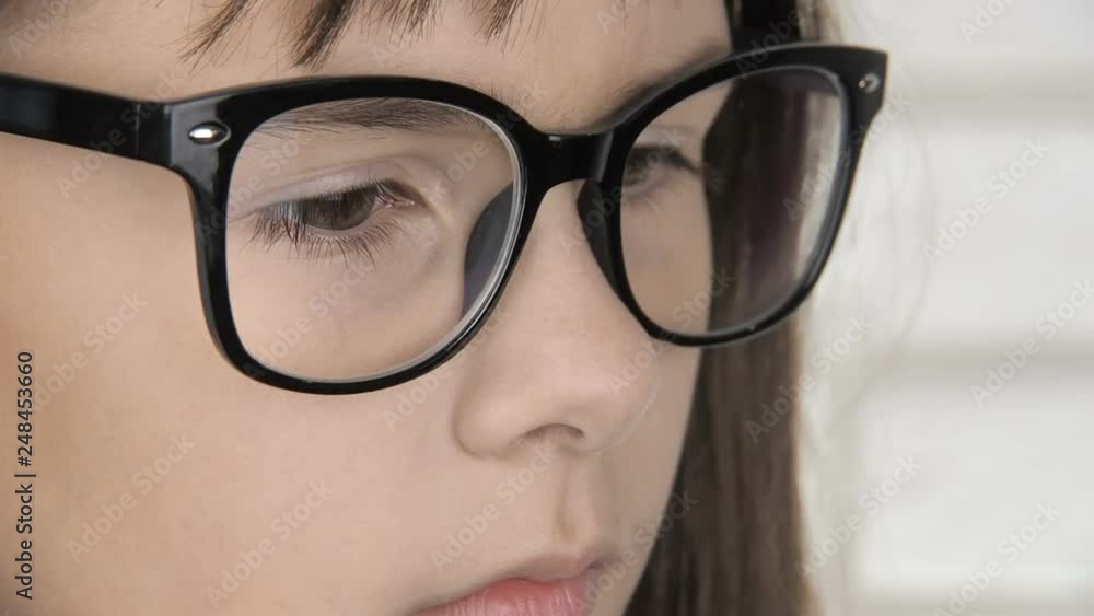 Child with bad eyesight wearing glasses. Portrait of a little girl with glasses. Child with bad eyesight wearing glasses. Portrait of a little girl with glasses.