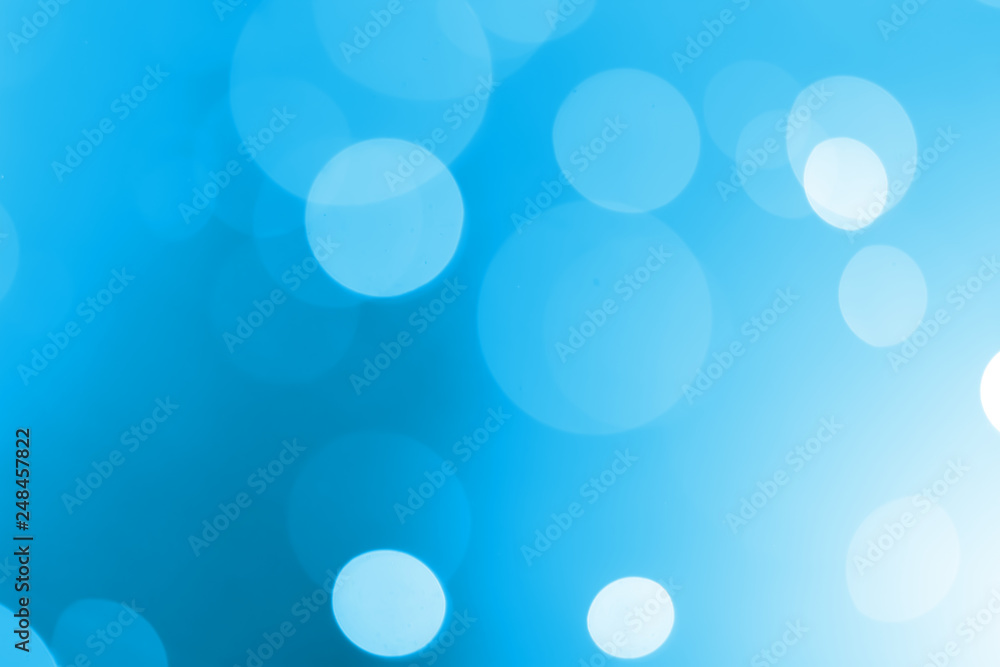 White bokeh on a blue background White bokeh on a blue background