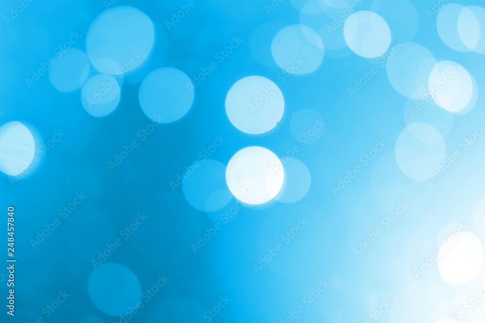 White bokeh on a blue background White bokeh on a blue background