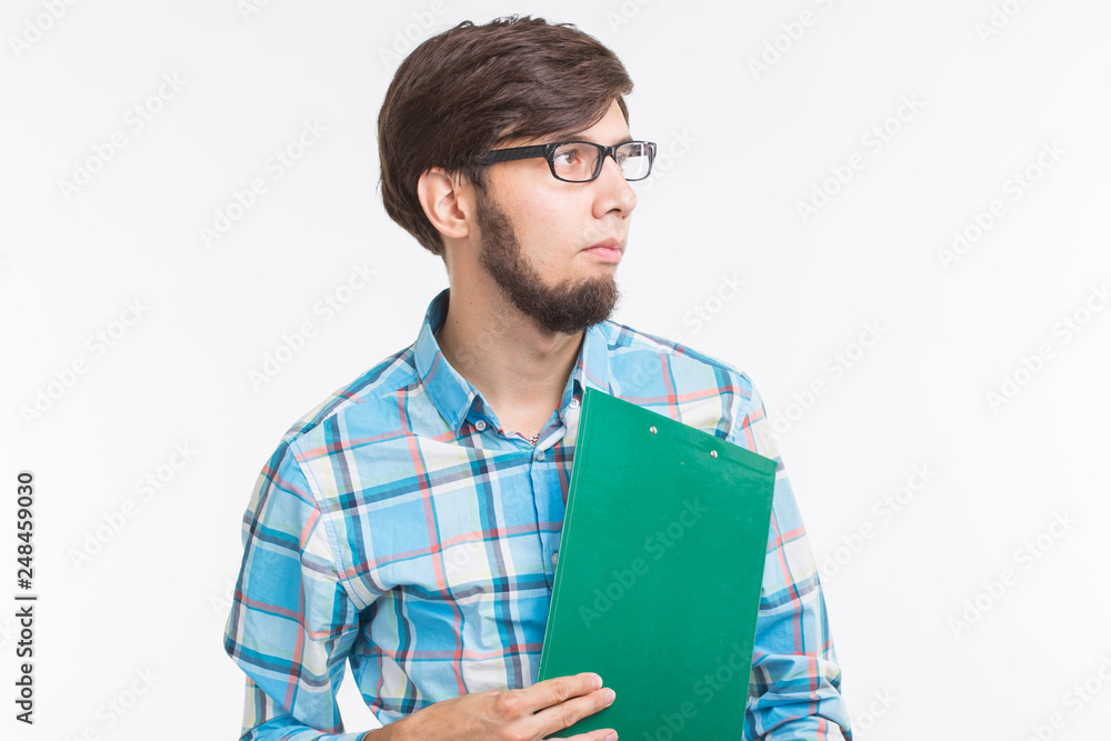 Business and emotions concept - Portrait of arab man with green paper folder Business and emotions concept - Portrait of arab man with green paper folder