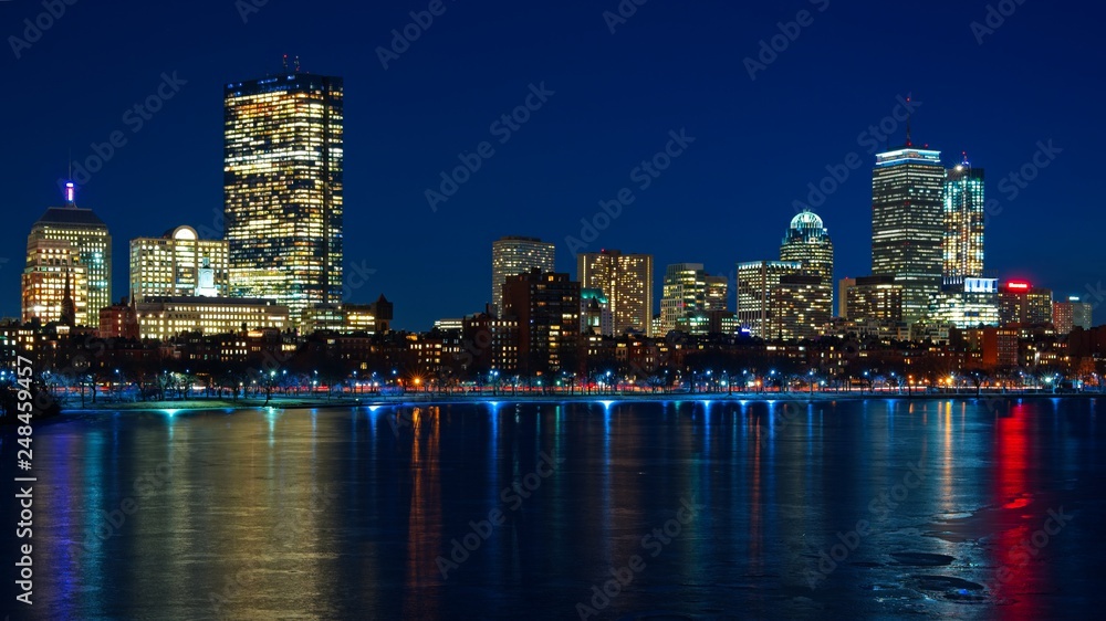 Long exposure of Boston skyline at night overlooking the Charles river