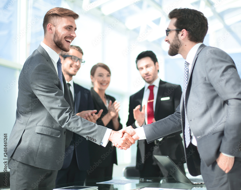 handshake of business people in a modern office handshake of business people in a modern office