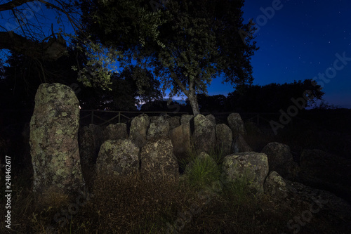 Landscape at dusk with ancient prehistoric dolmen. Gran Dolmen in Montehermoso. Extremadura Spain. photo