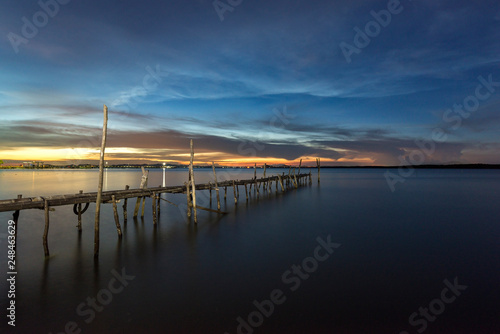 Bamboo bridge in the sea the twilight © Aniroot