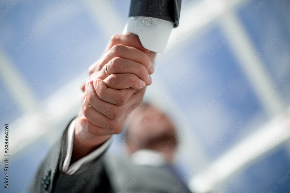 close up.handshake of business people on a light background.