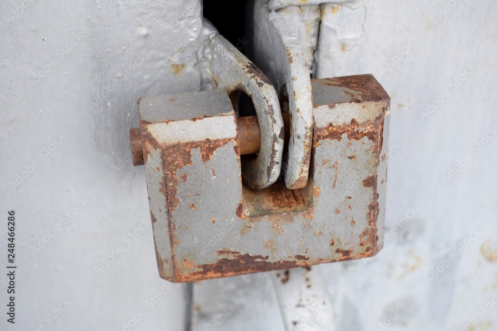 Old iron lock on an old garage door Old iron lock on an old garage door
