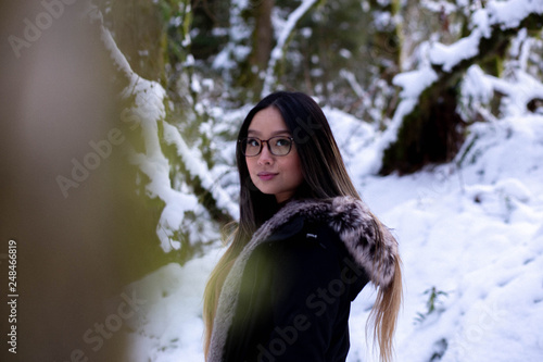 young woman in winter forest