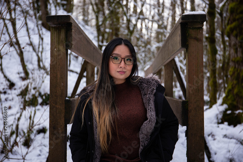 young woman in winter forest