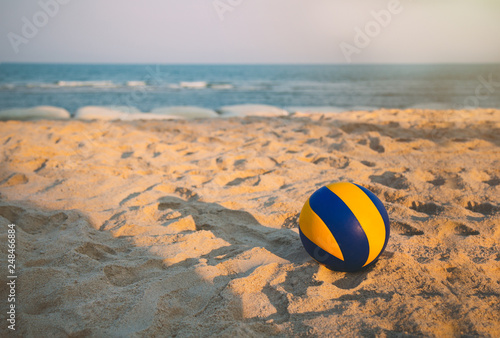 Wallpaper Mural volleyball dropped on the beach in sunset with open sea and clear sky. Torontodigital.ca