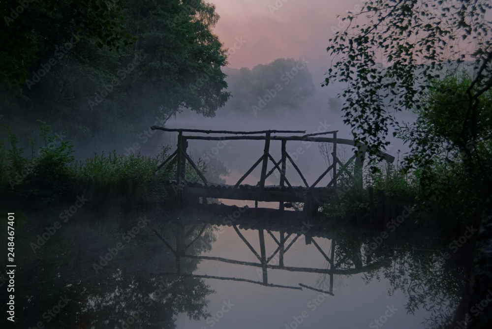 Fototapeta premium Old wooden bridge at sunrise