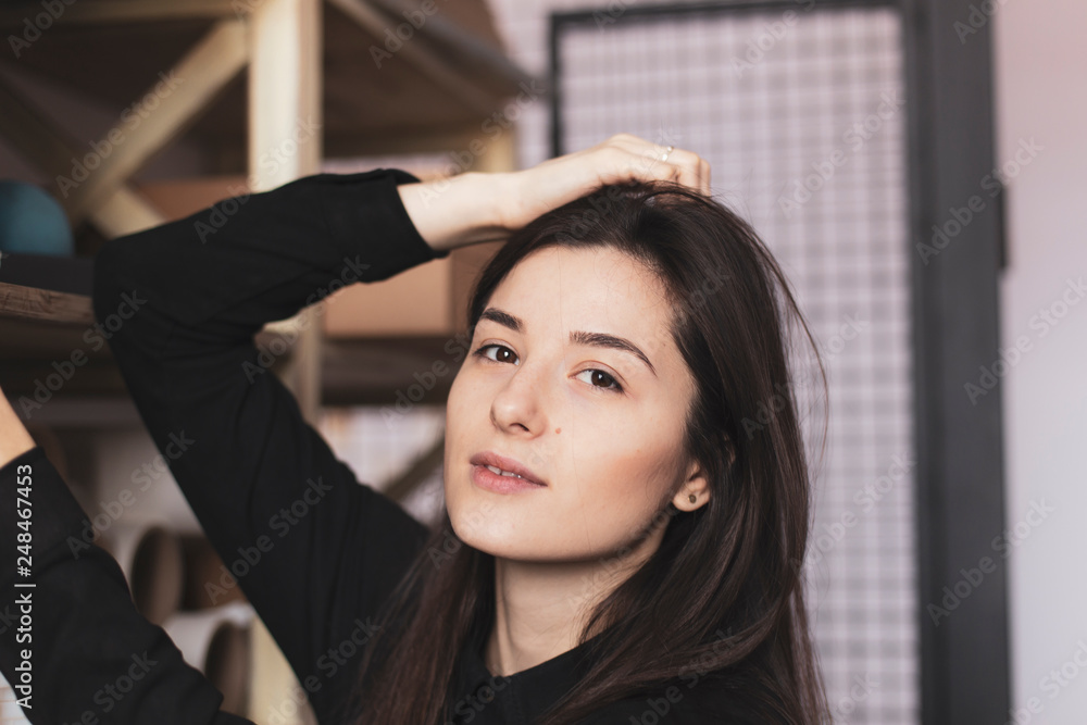 young pretty girl, student, hipster, doing a startup, working in an office or library, browsing dusty shelves with cardboard boxes in typography young pretty girl, student, hipster, doing a startup, working in an office or library, browsing dusty shelves with cardboard boxes in typography