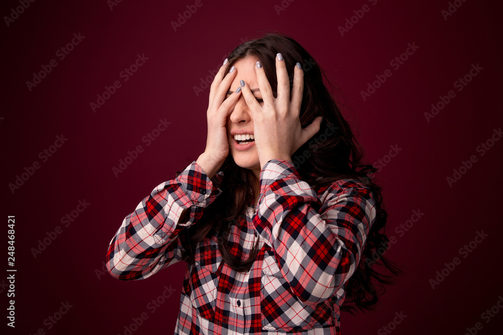 oung woman covering her eyes isolated on color background oung woman covering her eyes isolated on color background