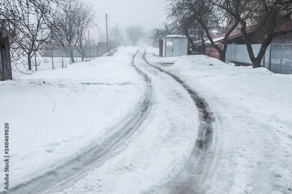 winding winter road in the snow with a little fog winding winter road in the snow with a little fog