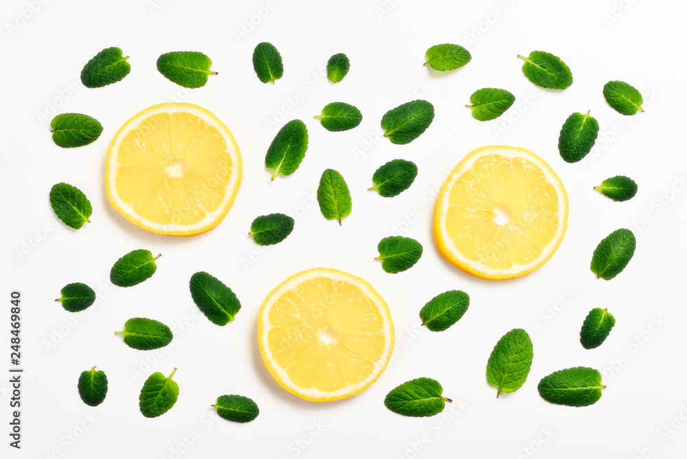 Mint leaves am lemon slices on white background Mint leaves am lemon slices on white background