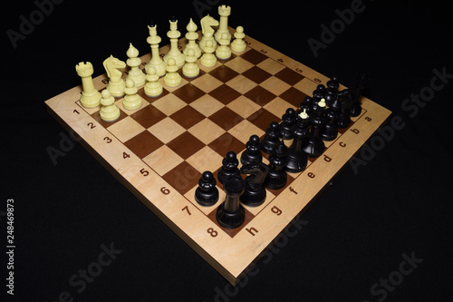 Chess board under white pieces like a hobby backdrop photo