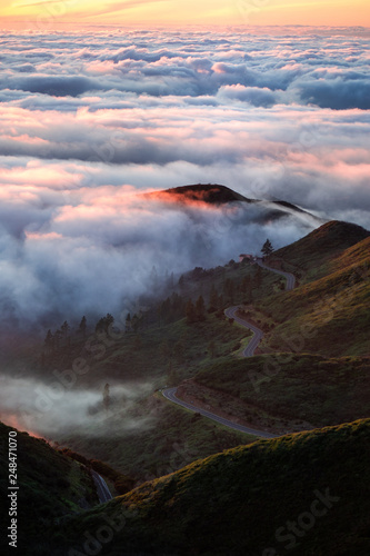 Road in the mountains above the clouds