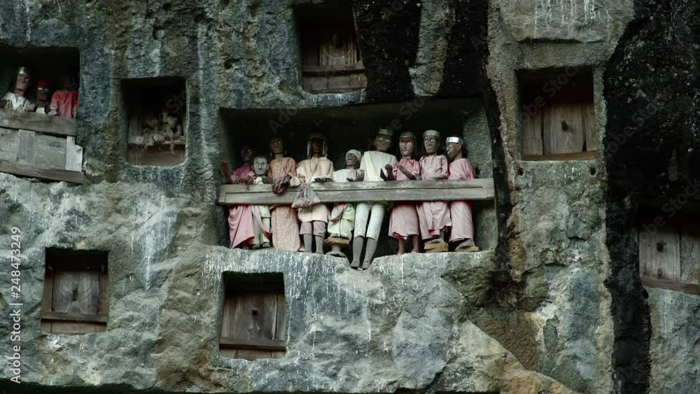 Famous funeral of Tana Toraja.Typical Toraja tombs in a vertical rock ...