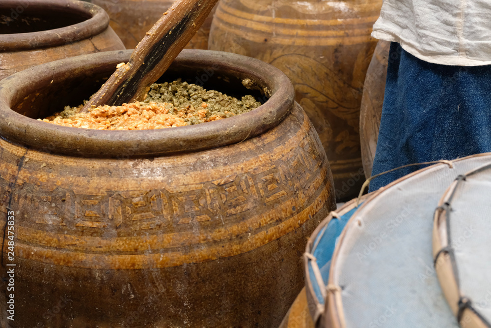 salted soybean paste in jar. soy miso production salted soybean paste in jar. soy miso production