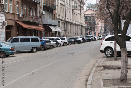 Parking along the road on a street in the center of the Dnipro. Cars parked on the street. Dnipro is the fourth largest city in Ukraine. © Ant