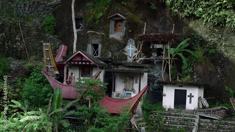 Famous funeral of Tana Toraja.Typical Toraja tombs in a vertical rock ...