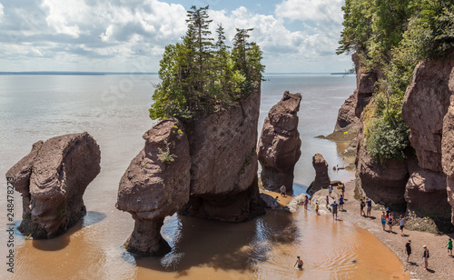 New Brunswick, Canada - August 5, 2017: View of Hopewell rocks, also called the Flowerpots Rocks, caused by tidal erosion in The Hopewell Rocks Ocean Tidal Exploration Site.