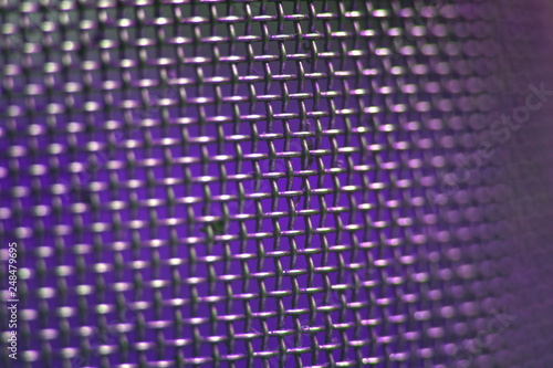 metal mesh with small cells in perspective  silver-violet  macro