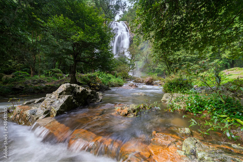 Waterfall.Water flowing over rocks coastline. 