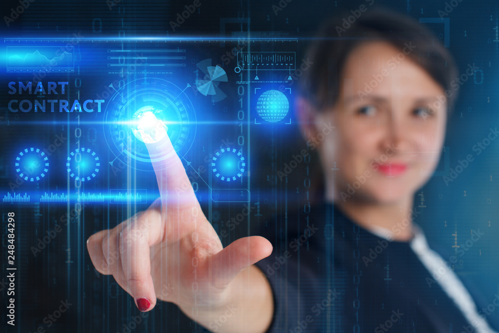 The concept of business, technology, the Internet and the network. A young entrepreneur working on a virtual screen of the future and sees the inscription: Smart contract The concept of business, technology, the Internet and the network. A young entrepreneur working on a virtual screen of the future and sees the inscription: Smart contract