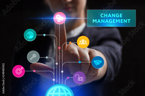 The concept of business, technology, the Internet and the network. A young entrepreneur working on a virtual screen of the future and sees the inscription: Change management