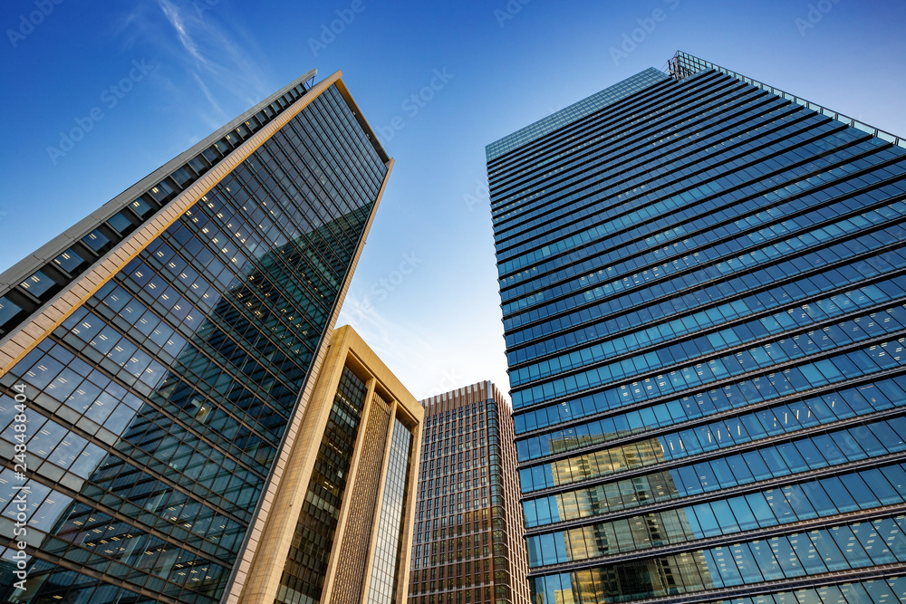 modern office buildings under a blue sky in Tokyo city..
