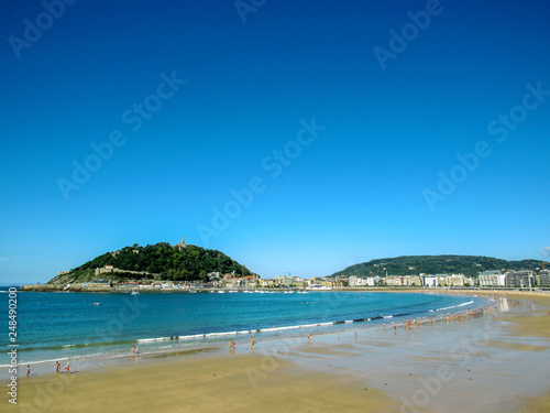 Landscape from the sunny main beach of San Sebastian, along the coastal Camino de Santiago, Northern Saint James Way