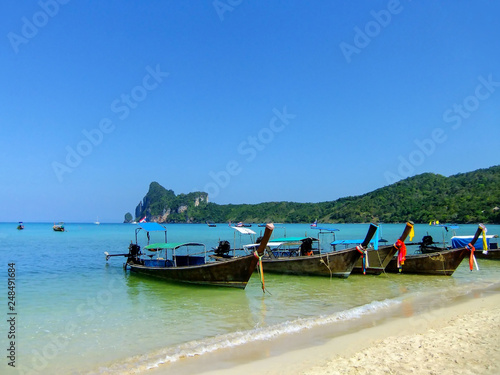 Longtail boats anchored at Ao Loh Dalum beach on Phi Phi Don Island, Krabi Province, Thailand © donyanedomam