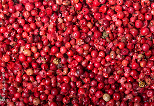 pink peppercorns as background photo