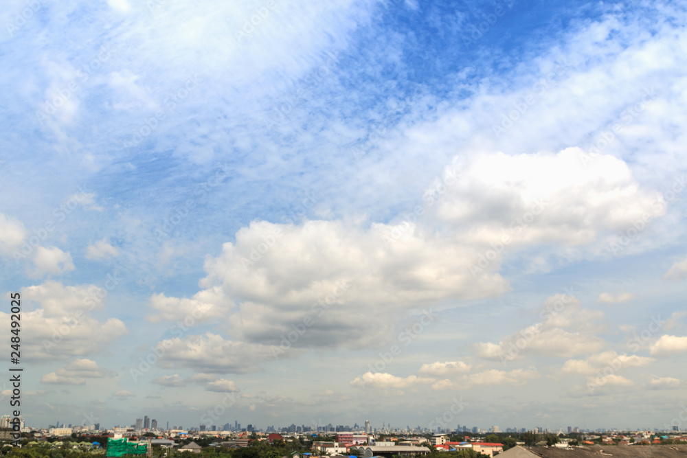 White  cumulus clouds on a blue sky  , over in city bangkok