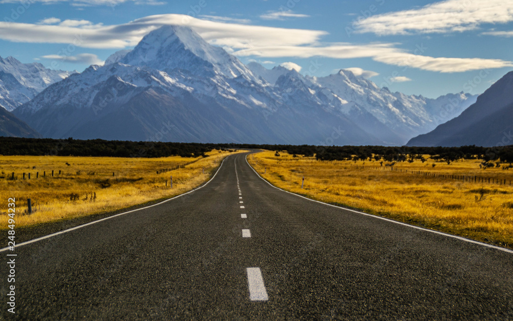 Beautiful Scenic landscape panoramic view of the empty road and the highest mountain of New Zealand - Aoraki/Mount Cook on background. Tourist popuar destination in South Island.