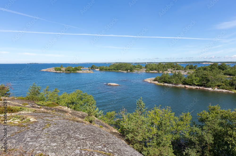 Rocky islands in the blue sea on a summer day. Finland.